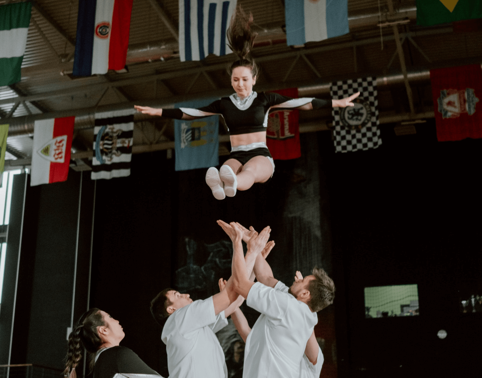 Cheerleader soaring through the air.