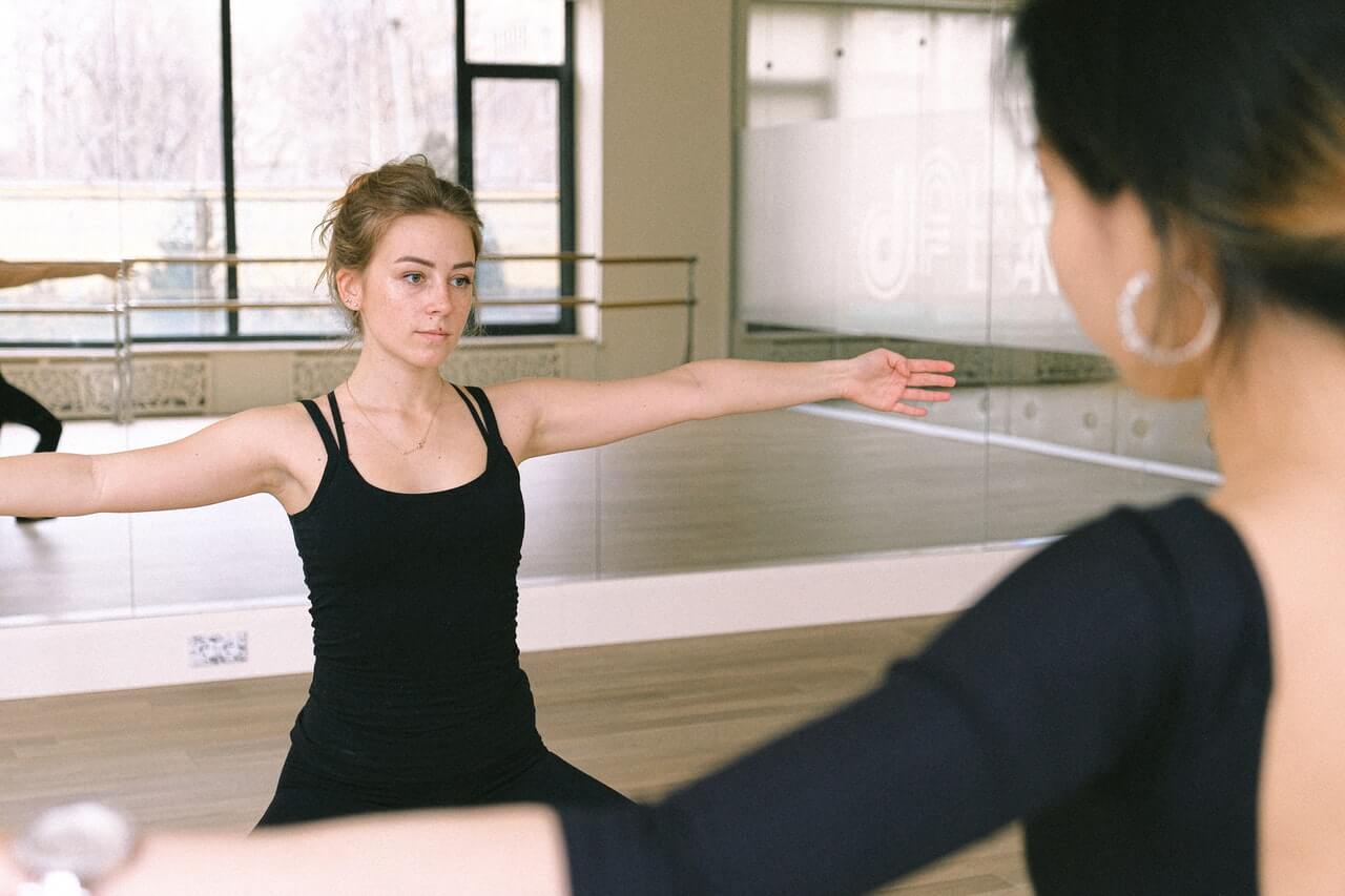 Instructor teaching at her dance studio