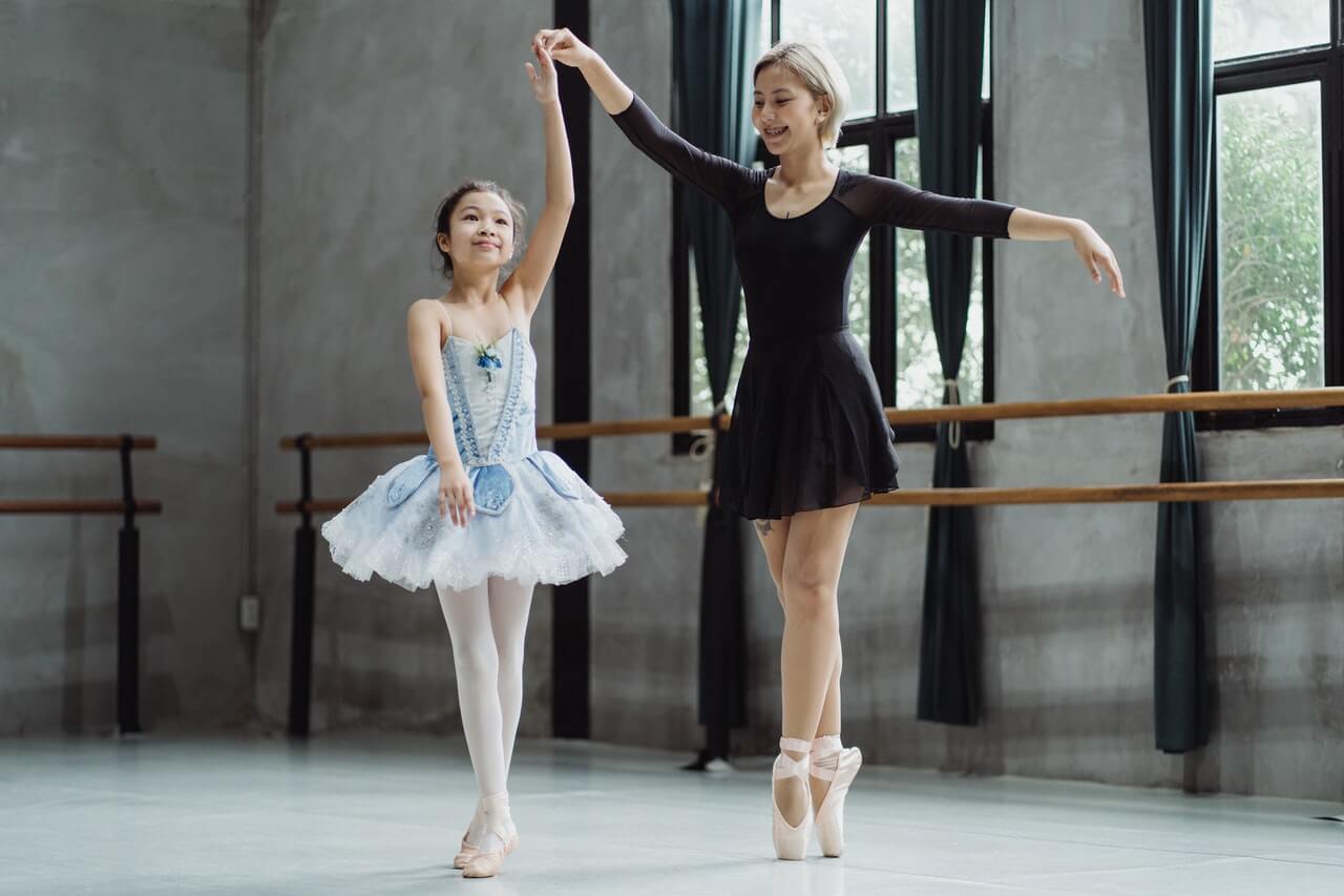 Girl dancing with ballet teacher, inspired by kids dance quotes