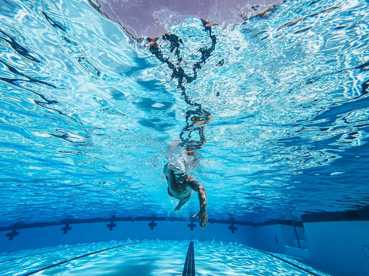 Man swimming to rehab an injury