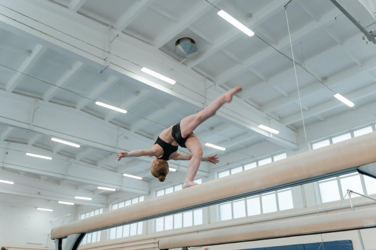 Gymnast performing a skill on the beam