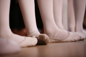 Dance studio with dancers lined up