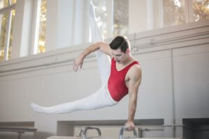 Man performing gymnastics on the pommel horse