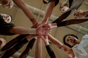 Team of coaches showing camaraderie