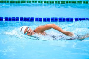 A swimmer in the pool enjoying the benefits of swimming