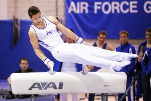 Athletes in gymnastics competition practicing sportsmanship
