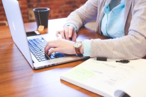Woman working with time-saving club software tools.