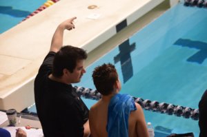 Swimmer coaching kids