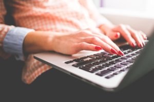Woman reading membership software guide online