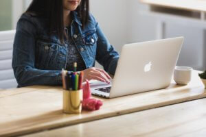 Woman on computer doing sports club website design